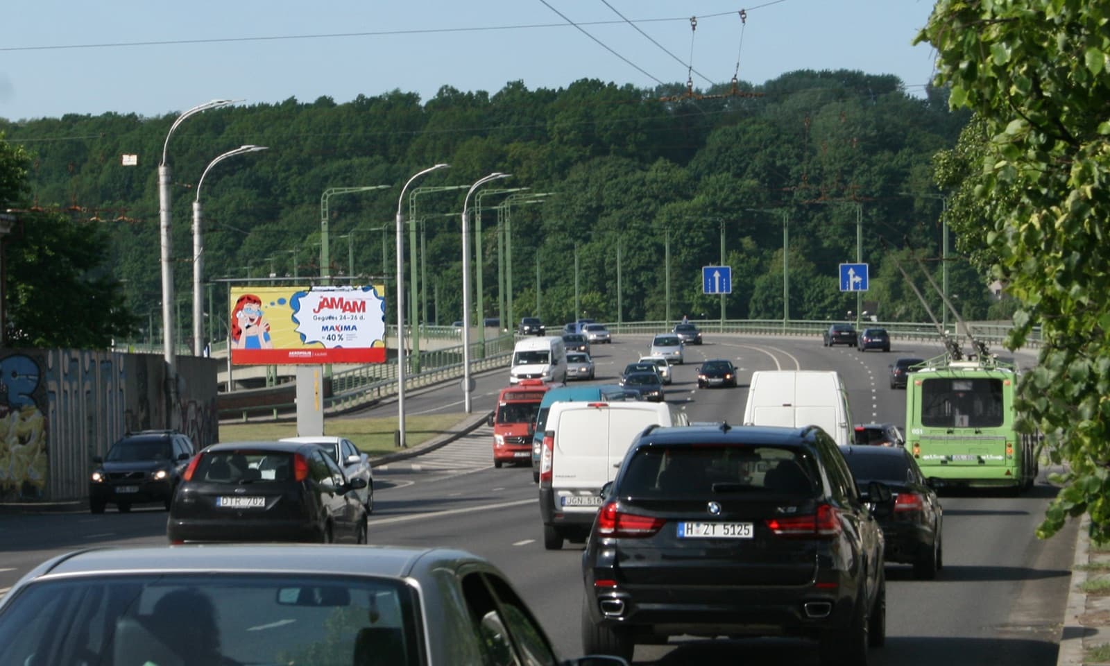 Reklamos stendas – M.K.Čiurlionio g. ir Kaunakiemio g. sankryža, netoli Kaunakiemio g. įvažos, Kaunas (A pusė)